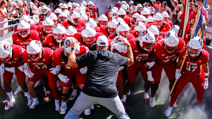 Oct 4, 2025; Raleigh, North Carolina, USA; NC State Wolfpack head coach Dave Doeren with his team prepare to run out prior to the first half of the game against Campbell Fighting Camels at Carter-Finley Stadium. Mandatory Credit: Jaylynn Nash-Imagn Images Oct 4, 2025; Raleigh, North Carolina, USA; NC State Wolfpack head coach Dave Doeren with his team prepare to run out prior to the first half of the game against Campbell Fighting Camels at Carter-Finley Stadium. Mandatory Credit: Jaylynn Nash-Imagn Images