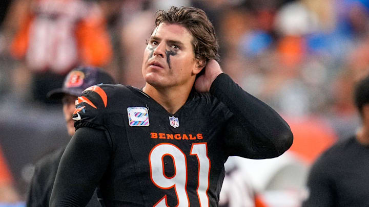 Cincinnati Bengals defensive end Trey Hendrickson (91) watches a replay as the Detroit Lions celebrate a touchdown in the fourth quarter of the NFL Week 5 game between the Cincinnati Bengals and the Detroit Lions at Paycor Stadium in downtown Cincinnati on Sunday, Oct. 5, 2025. The Bengals continued a losing streak, falling 37-24 to the Lions. Cincinnati Bengals defensive end Trey Hendrickson (91) watches a replay as the Detroit Lions celebrate a touchdown in the fourth quarter of the NFL Week 5 game between the Cincinnati Bengals and the Detroit Lions at Paycor Stadium in downtown Cincinnati on Sunday, Oct. 5, 2025. The Bengals continued a losing streak, falling 37-24 to the Lions.