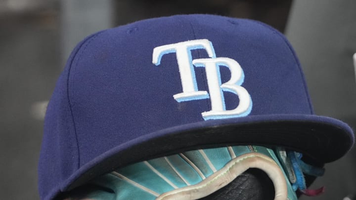 Sep 26, 2025; Toronto, Ontario, CAN; The hat and glove of Tampa Bay Rays third baseman Junior Caminero (13) in the dugout during the game against the Toronto Blue Jays at Rogers Centre. 
