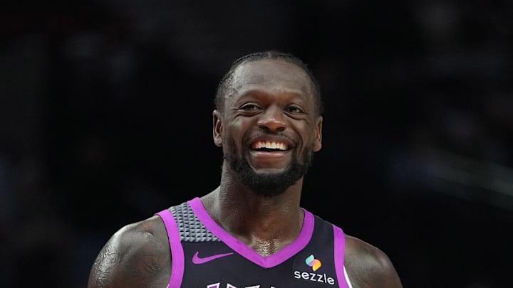 Feb 24, 2026; Portland, Oregon, USA; Minnesota Timberwolves forward Julius Randle (30) and Portland Trail Blazers guard Jrue Holiday (5) share a laugh during the second half at Moda Center. Mandatory Credit: Soobum Im-Imagn Images