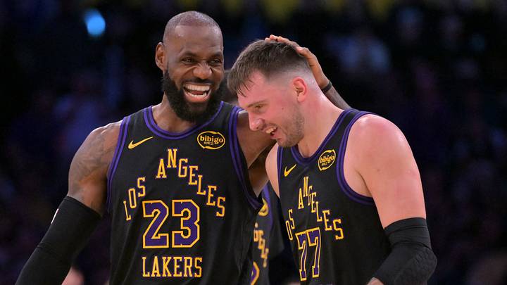 Los Angeles Lakers forward LeBron James (23) and Los Angeles Lakers guard Luka Doncic (77) walk to the bench during a time out in the second half at Crypto.com Arena. 