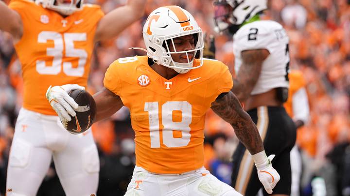 Tennessee running back DeSean Bishop (18) and wide receiver Ben Petermann (35) celebrate after Bishop scores a touchdown in an NCAA college football game against Vanderbilt on Nov. 29, 2025, in Knoxville, Tennessee. Tennessee running back DeSean Bishop (18) and wide receiver Ben Petermann (35) celebrate after Bishop scores a touchdown in an NCAA college football game against Vanderbilt on Nov. 29, 2025, in Knoxville, Tennessee.