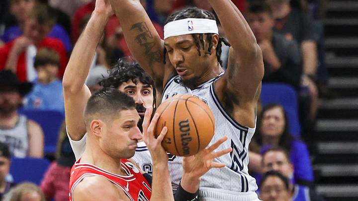 Nov 27, 2024; Orlando, Florida, USA; Orlando Magic center Wendell Carter Jr. (34) and center Goga Bitadze (35) defend Chicago Bulls center Nikola Vucevic (9) during the first quarter at Kia Center. Mandatory Credit: Mike Watters-Imagn Images Nov 27, 2024; Orlando, Florida, USA; Orlando Magic center Wendell Carter Jr. (34) and center Goga Bitadze (35) defend Chicago Bulls center Nikola Vucevic (9) during the first quarter at Kia Center. Mandatory Credit: Mike Watters-Imagn Images
