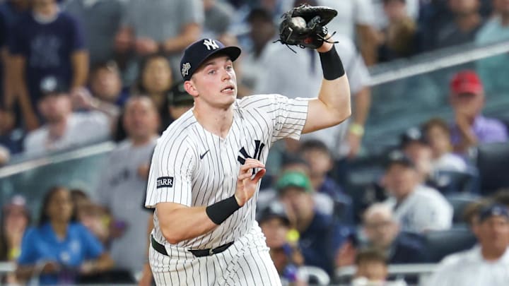 Oct 7, 2025; Bronx, New York, USA; New York Yankees first baseman Ben Rice (22) catches a ball for the final out in the second inning against the Toronto Blue Jays during game three of the ALDS round for the 2025 MLB playoffs at Yankee Stadium. Mandatory Credit: Vincent Carchietta-Imagn Images
