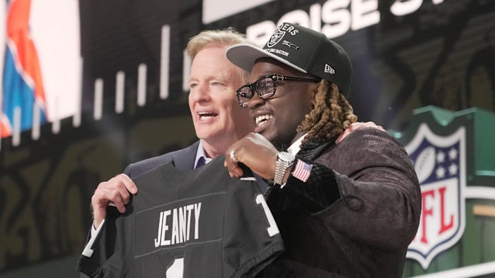 NFL Commissioner Rodger Goodell, left, with Boise State Broncos running back Ashton Jeanty is selected by the Las Vegas Raiders as the number six pick in the first round of the 2025 NFL Draft at Lambeau Field. Mark Hoffman / Milwaukee Journal Sentinel