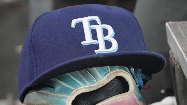 Sep 26, 2025; Toronto, Ontario, CAN; The hat and glove of Tampa Bay Rays third baseman Junior Caminero (13) in the dugout during the game against the Toronto Blue Jays at Rogers Centre. Sep 26, 2025; Toronto, Ontario, CAN; The hat and glove of Tampa Bay Rays third baseman Junior Caminero (13) in the dugout during the game against the Toronto Blue Jays at Rogers Centre.