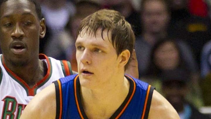 New York Knicks center Timofey Mozgov holds the ball during the game against the Milwaukee Bucks. New York Knicks center Timofey Mozgov holds the ball during the game against the Milwaukee Bucks.