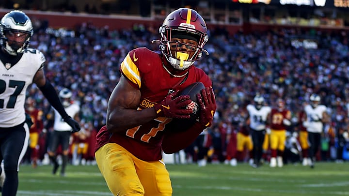 Dec 22, 2024; Landover, Maryland, USA; Washington Commanders wide receiver Terry McLaurin (17) catches a touchdown pass against Philadelphia Eagles cornerback Quinyon Mitchell (27) during the second quarter at Northwest Stadium. Mandatory Credit: Peter Casey-Imagn Images Dec 22, 2024; Landover, Maryland, USA; Washington Commanders wide receiver Terry McLaurin (17) catches a touchdown pass against Philadelphia Eagles cornerback Quinyon Mitchell (27) during the second quarter at Northwest Stadium. Mandatory Credit: Peter Casey-Imagn Images