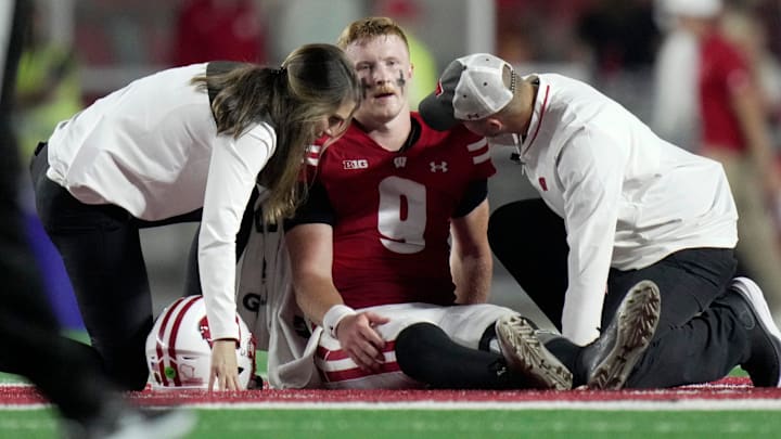 Wisconsin quarterback Billy Edwards Jr. (9) is tended to after being injured during the second quarter of their game against Miami (Ohio) Thursday, August 28, 2025 at Camp Randall Stadium in Madison, Wisconsin.