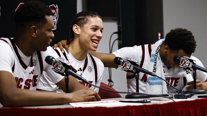 Dec 6, 2025; Raleigh, North Carolina, USA; NC State Wolfpack guard Quadir Copeland (11) gets emotional over guard Matt Able (3) praise for him during the presser of the game against the Liberty Flames at Lenovo Center. Mandatory Credit: Jaylynn Nash-Imagn Images Dec 6, 2025; Raleigh, North Carolina, USA; NC State Wolfpack guard Quadir Copeland (11) gets emotional over guard Matt Able (3) praise for him during the presser of the game against the Liberty Flames at Lenovo Center. Mandatory Credit: Jaylynn Nash-Imagn Images