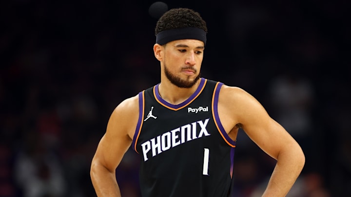 Apr 14, 2026; Phoenix, Arizona, USA; Phoenix Suns guard Devin Booker (1) against the Portland Trail Blazers during the play-in rounds of the 2026 NBA Playoffs at Mortgage Matchup Center. Mandatory Credit: Mark J. Rebilas-Imagn Images
Apr 14, 2026; Phoenix, Arizona, USA; Phoenix Suns guard Devin Booker (1) against the Portland Trail Blazers during the play-in rounds of the 2026 NBA Playoffs at Mortgage Matchup Center. Mandatory Credit: Mark J. Rebilas-Imagn Images