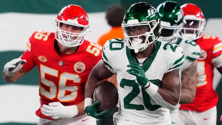 New York Jets running back Breece Hall (20) runs past the Chiefs' defense for a 2nd half 1st down at MetLife Stadium.