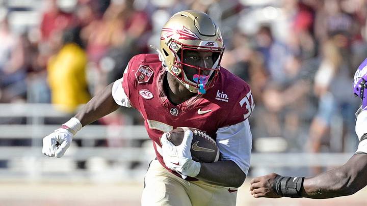 Sep 26, 2026; Tallahassee, Florida, USA; Florida State Seminoles running back Ousmane Kromah (32) runs against Central Arkansas Bears linebacker Ashtyn Williams (34) during the second half at Doak S. Campbell Stadium. Mandatory Credit: Melina Myers-Imagn Images Sep 26, 2026; Tallahassee, Florida, USA; Florida State Seminoles running back Ousmane Kromah (32) runs against Central Arkansas Bears linebacker Ashtyn Williams (34) during the second half at Doak S. Campbell Stadium. Mandatory Credit: Melina Myers-Imagn Images