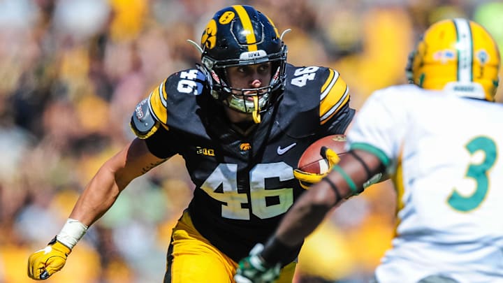 Sep 17, 2016; Iowa City, IA, USA;  Iowa Hawkeyes tight end George Kittle (46) runs with the ball as North Dakota State Bison safety Tre Dempsey (3) looks to make a tackle during the game at Kinnick Stadium. North Dakota State won 23-21. Mandatory Credit: Jeffrey Becker-Imagn Images