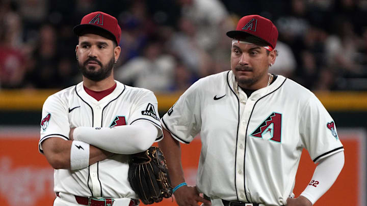 Jun 9, 2025; Phoenix, Arizona, USA; Arizona Diamondbacks third base Eugenio Suarez (28) and first base Josh Naylor (22) talk in the ninth inning against the Seattle Mariners at Chase Field. Mandatory Credit: Rick Scuteri-Imagn Images Jun 9, 2025; Phoenix, Arizona, USA; Arizona Diamondbacks third base Eugenio Suarez (28) and first base Josh Naylor (22) talk in the ninth inning against the Seattle Mariners at Chase Field. Mandatory Credit: Rick Scuteri-Imagn Images