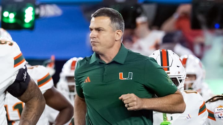 Jan 8, 2026; Glendale, AZ, USA; Miami Hurricanes head coach Mario Cristobal against the Mississippi Rebels during the 2026 Fiesta Bowl and semifinal game of the College Football Playoff at State Farm Stadium. Mandatory Credit: Mark J. Rebilas-Imagn Images Jan 8, 2026; Glendale, AZ, USA; Miami Hurricanes head coach Mario Cristobal against the Mississippi Rebels during the 2026 Fiesta Bowl and semifinal game of the College Football Playoff at State Farm Stadium. Mandatory Credit: Mark J. Rebilas-Imagn Images