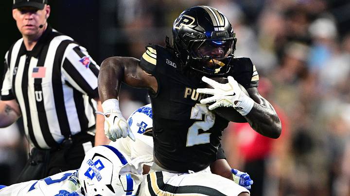 Purdue Boilermakers running back Fame Ijeboi (2) avoids a tackle. Purdue Boilermakers running back Fame Ijeboi (2) avoids a tackle.