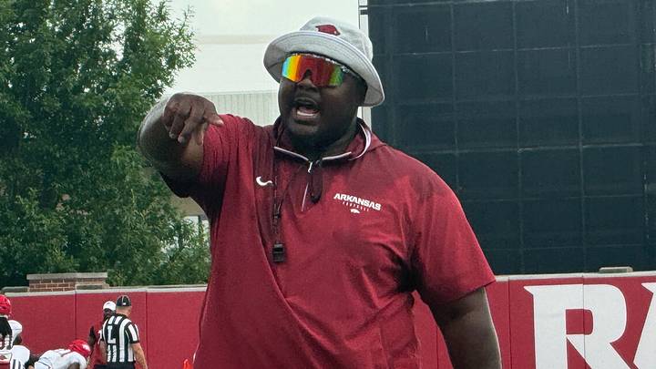 Arkansas offensive line coach Marcus Johnson instructs his players during Friday's training camp on Aug. 7, 2026. Arkansas offensive line coach Marcus Johnson instructs his players during Friday's training camp on Aug. 7, 2026.