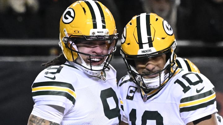 Green Bay Packers receiver Christian Watson (9) and quarterback Jordan Love (10) react after hooking up on a touchdown pass.