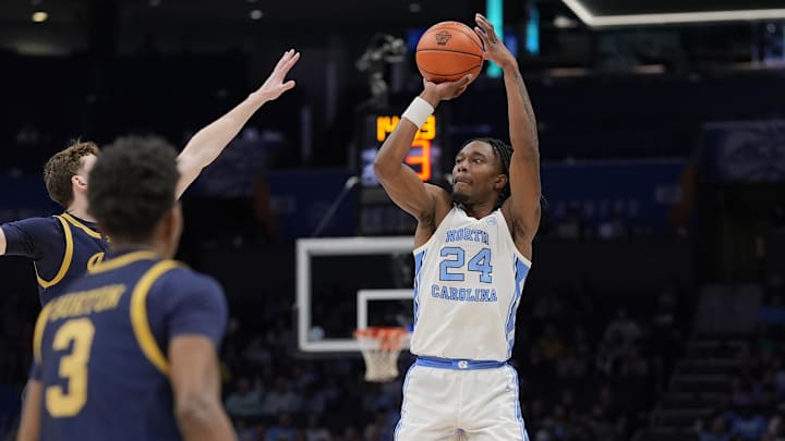 Mar 12, 2025; Charlotte, NC, USA; North Carolina Tar Heels forward Jae'Lyn Withers (24) shoots from long range against the Notre Dame Fighting Irish during the second half at Spectrum Center. Mandatory Credit: Jim Dedmon-Imagn Images