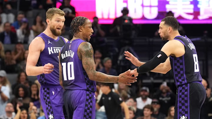 Apr 11, 2025; Sacramento, California, USA; Sacramento Kings forward DeMar DeRozan (10) talks with forward Domantas Sabonis (left) and guard Zach LaVine (8) during the fourth quarter against the Los Angeles Clippers at Golden 1 Center. Mandatory Credit: Darren Yamashita-Imagn Images Apr 11, 2025; Sacramento, California, USA; Sacramento Kings forward DeMar DeRozan (10) talks with forward Domantas Sabonis (left) and guard Zach LaVine (8) during the fourth quarter against the Los Angeles Clippers at Golden 1 Center. Mandatory Credit: Darren Yamashita-Imagn Images