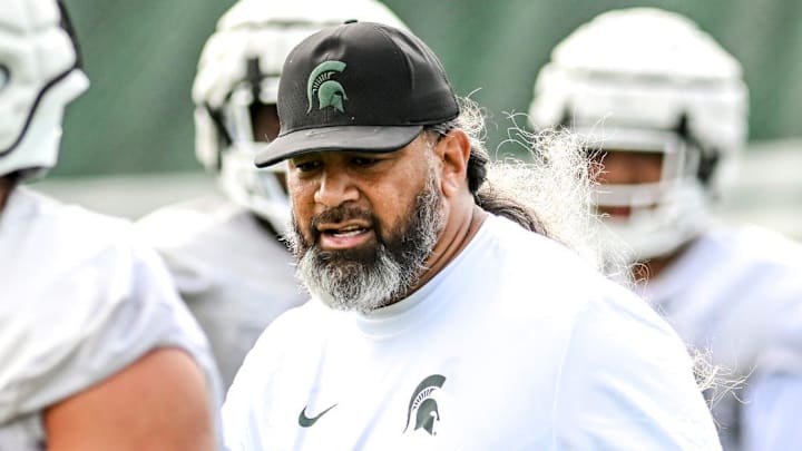 Michigan State's defensive line coach Legi Suiaunoa works with players during the first day of football camp on Tuesday, July 30, 2024, in East Lansing.