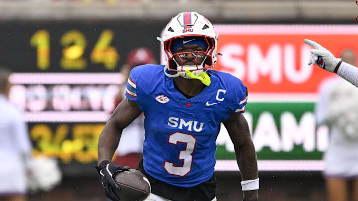 SMU Mustangs safety Ahmaad Moses intercepts a pass intended for Miami Hurricanes wide receiver Joshisa Trader 