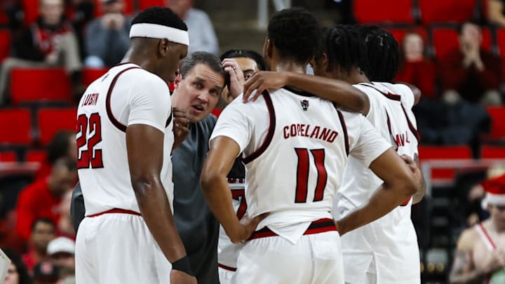 Dec 6, 2025; Raleigh, North Carolina, USA; NC State Wolfpack huddle with head coach Will Wade during the second half of the game against UNC Asheville Bulldogs at Lenovo Center. Mandatory Credit: Jaylynn Nash-Imagn Images