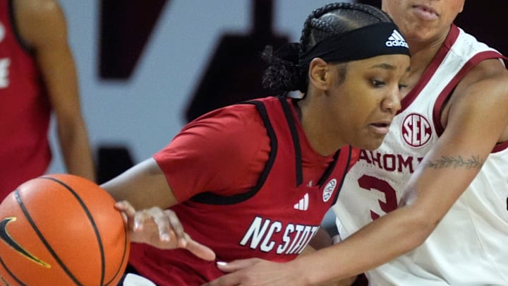 Oklahoma Sooners guard Zya Vann (3) knocks the ball away from NC State Wolfpack guard Destiny Lunan (7) during a women's college basketball game between the University of Oklahoma Sooners (OU) and the NC State Wolfpack at Lloyd Noble Center in Norman, Okla., Wednesday, Dec. 3, 2025. Oklahoma won 103-98. Oklahoma Sooners guard Zya Vann (3) knocks the ball away from NC State Wolfpack guard Destiny Lunan (7) during a women's college basketball game between the University of Oklahoma Sooners (OU) and the NC State Wolfpack at Lloyd Noble Center in Norman, Okla., Wednesday, Dec. 3, 2025. Oklahoma won 103-98.