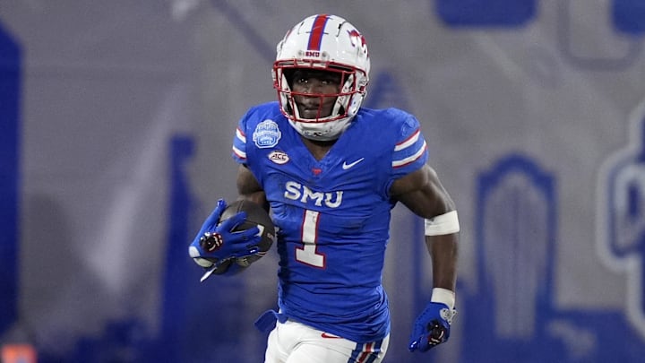 Dec 7, 2024; Charlotte, NC, USA; Southern Methodist Mustangs running back Brashard Smith (1) runs during the second quarter against the Clemson Tigers in the 2024 ACC Championship game at Bank of America Stadium. Mandatory Credit: Jim Dedmon-Imagn Images
