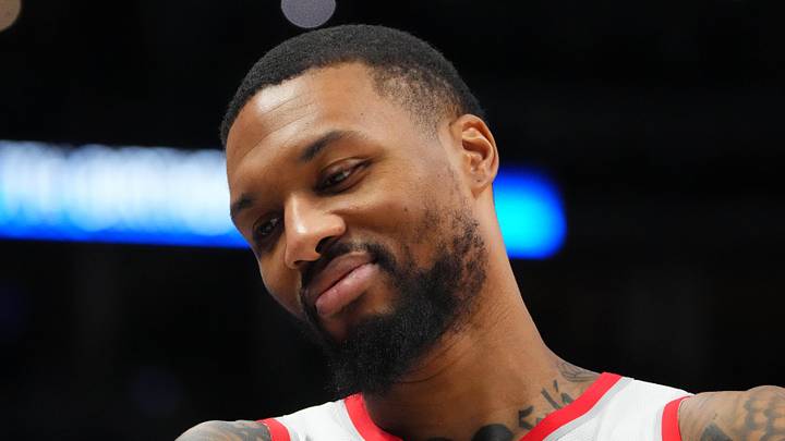 Dec 23, 2022; Denver, Colorado, USA; Portland Trail Blazers guard Damian Lillard (0) reacts towards the Denver Nuggets bench in the second half at Ball Arena. Mandatory Credit: Ron Chenoy-Imagn Images