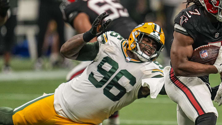 Sep 17, 2023; Atlanta, Georgia, USA; Atlanta Falcons running back Bijan Robinson (7) runs against Green Bay Packers defensive tackle Colby Wooden (96) during the second half at Mercedes-Benz Stadium. Mandatory Credit: Dale Zanine-Imagn Images