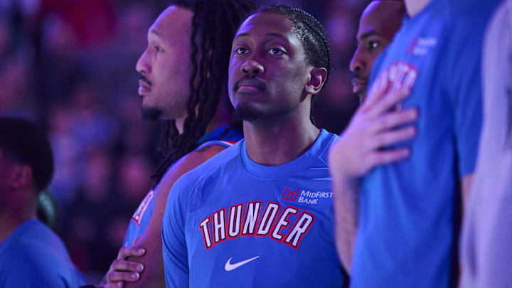 Nov 30, 2025; Portland, Oregon, USA; Oklahoma City Thunder guard Jalen Williams (8) stands with teammates during the singing of the national anthem before a game against the Portland Trail Blazers at Moda Center. Mandatory Credit: Troy Wayrynen-Imagn Images