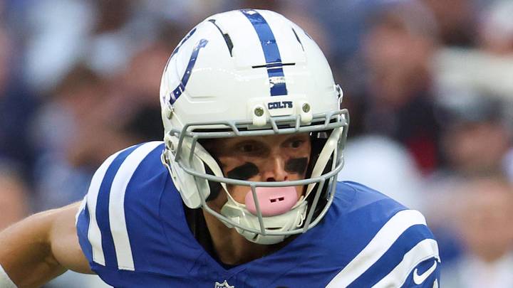 Oct 12, 2025; Indianapolis, Indiana, USA; Indianapolis Colts wide receiver Alec Pierce (14) carries the ball against the Arizona Cardinals during the fourth quarter of the game at Lucas Oil Stadium. Mandatory Credit: Trevor Ruszkowski-Imagn Images