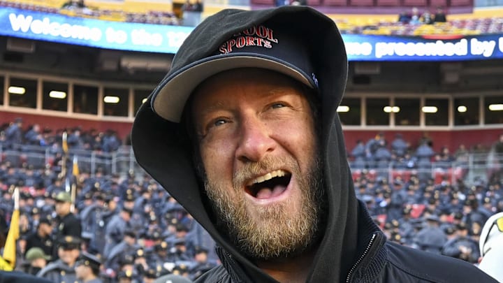 Dec 14, 2024; Landover, Maryland, USA;   Dave Portnoy, Bar Stool Sports  founder and owner  walks along the sidelines before the playing of the 125 Army Navy game at Commanders Field. Mandatory Credit: Tommy Gilligan-Imagn Images

Dec 14, 2024; Landover, Maryland, USA;  Dave Portnoy poses with solders before the between the Army Black Knights and the Navy Midshipmen  at Commanders Field. Mandatory Credit: Tommy Gilligan-Imagn Images