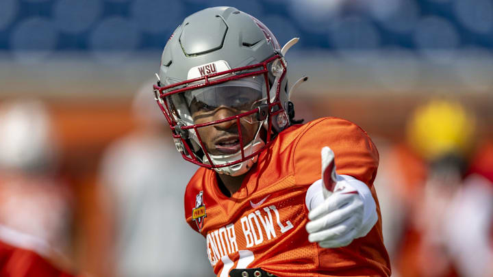 Jan 28, 2025; Mobile, AL, USA; National team wide receiver Kyle Williams of Washington State (11) sets up at the line during Senior Bowl practice for the National team at Hancock Whitney Stadium. Mandatory Credit: Vasha Hunt-Imagn Images