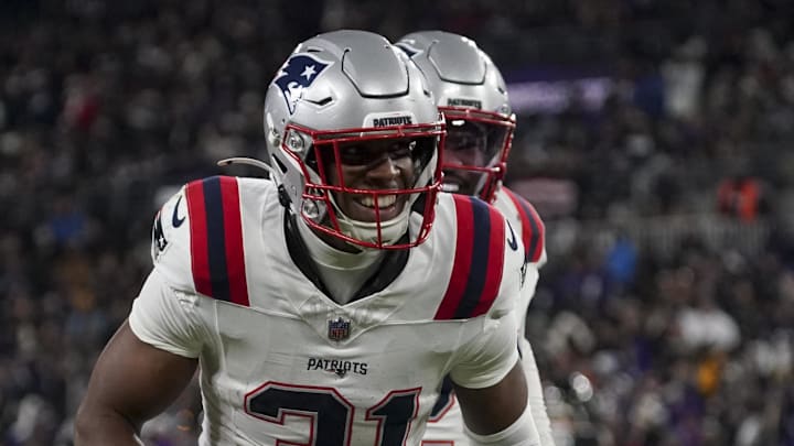 Dec 21, 2025; Baltimore, Maryland, USA;  New England Patriots safety Craig Woodson (31) celebrates a Patriots recovering a fumble by Baltimore Ravens running back Derrick Henry (not pictured) during the first half of the game at M&T Bank Stadium. Mandatory Credit: James Lang-Imagn Images