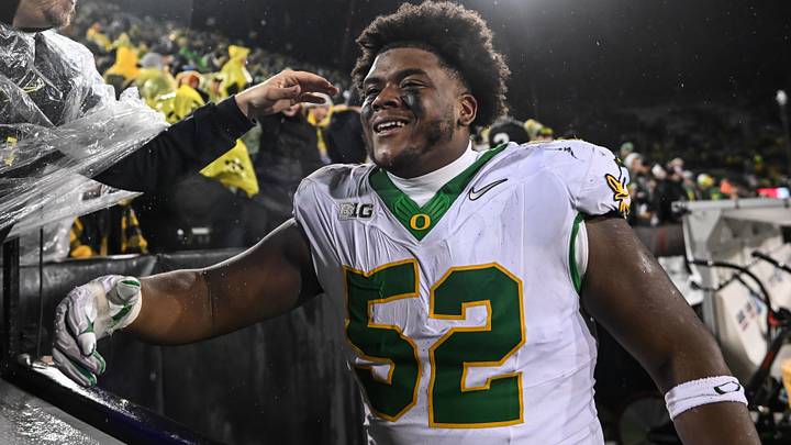 Oregon Ducks defensive lineman A'Mauri Washington reacts with fans after the game against the Iowa Hawkeyes.