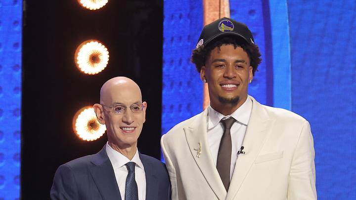 Jun 23, 2026; New York, NY, USA; NBA commissioner Adam Silver greets the eleventh pick in the 2026 NBA draft, Michigan forward Yaxel Lendeborg after he was selected by the Golden State Warriors at Barclays Center. Mandatory Credit: Brad Penner-Imagn Images