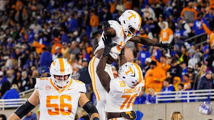 Oct 25, 2025; Lexington, Kentucky, USA; Tennessee Volunteers offensive lineman David Sanders Jr. (70) celebrates with wide receiver Mike Matthews (4) after Matthews scores a touchdown during the third quarter against the Kentucky Wildcats at Kroger Field. Mandatory Credit: Jordan Prather-Imagn Images Oct 25, 2025; Lexington, Kentucky, USA; Tennessee Volunteers offensive lineman David Sanders Jr. (70) celebrates with wide receiver Mike Matthews (4) after Matthews scores a touchdown during the third quarter against the Kentucky Wildcats at Kroger Field. Mandatory Credit: Jordan Prather-Imagn Images