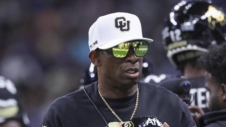 Dec 28, 2024; San Antonio, TX, USA; Colorado Buffaloes head coach Deion Sanders walks on the field between plays during the first quarter against the Brigham Young Cougars at Alamodome. Mandatory Credit: Troy Taormina-Imagn Images