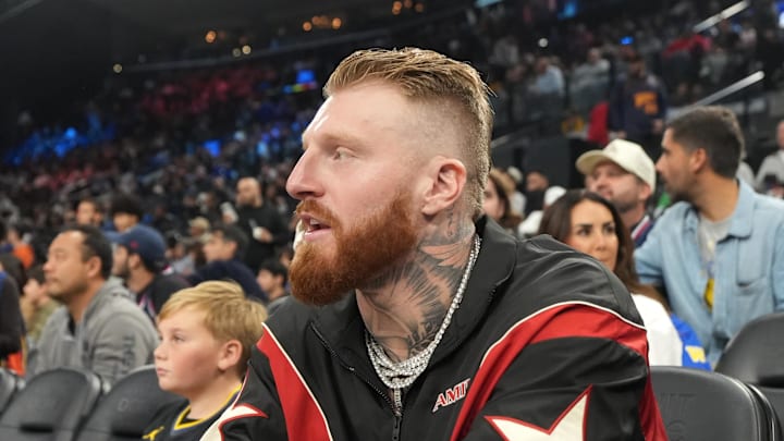 Jan 5, 2026; Inglewood, California, USA; Las Vegas Raiders defensive end Maxx Crosby (left) and wife Rachel Washburn attend the game between the Golden State Warriors and the LA Clippers at the Intuit Dome. Mandatory Credit: Kirby Lee-Imagn Images