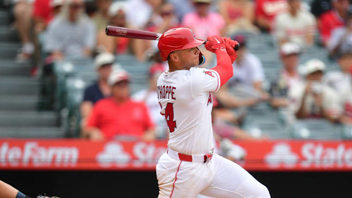 Apr 5, 2026; Anaheim, California, USA; Los Angeles Angels catcher Logan O'Hoppe (14) hits a sacrifice RBI against the Seattle Mariners during the tenth inning at Angel Stadium. Mandatory Credit: Gary A. Vasquez-Imagn Images