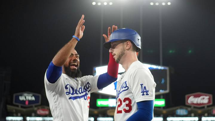 Aug 10, 2026; Los Angeles, California, USA; Los Angeles Dodgers right fielder Kyle Tucker (23) is congratulated by right fielder Teoscar Hernández (37) after scoring in the seventh inning against the Kansas City Royals at Dodger Stadium. Mandatory Credit: Kirby Lee-Imagn Images