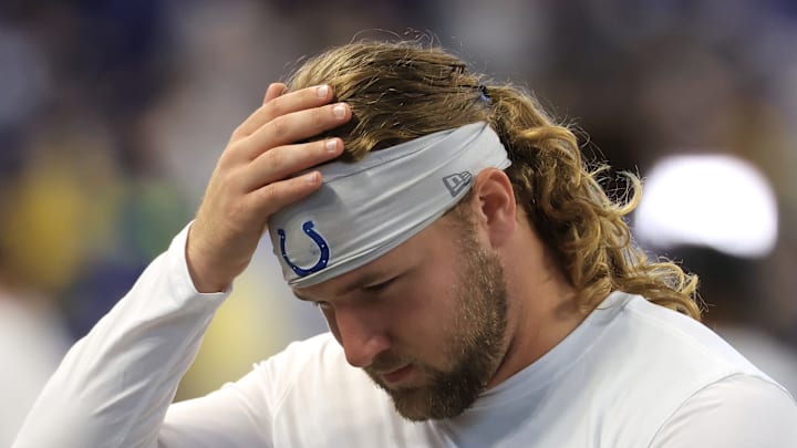 Tyler Warren of the Indianapolis Colts holds his head