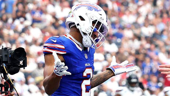 Buffalo Bills wide receiver DJ Moore and quarterback Josh Allen celebrate after a touchdown against the Houston Texans.