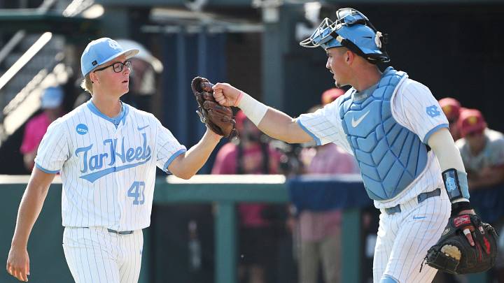June 7, 2026; Chapel Hill, NC, USA; North Carolina Tar Heels catcher Colin Hynek (23) celebrates with pitcher Walker McDuffie (40) in the ninth inning against the USC Trojans at Boshamer Stadium. Mandatory Credit: Zachary Taft-Imagn Images June 7, 2026; Chapel Hill, NC, USA; North Carolina Tar Heels catcher Colin Hynek (23) celebrates with pitcher Walker McDuffie (40) in the ninth inning against the USC Trojans at Boshamer Stadium. Mandatory Credit: Zachary Taft-Imagn Images