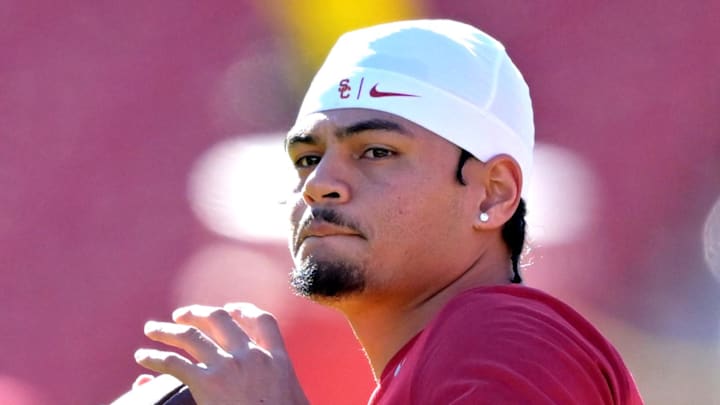Oct 11, 2025; Los Angeles, California, USA;  USC Trojans quarterback Jayden Maiava (14) warms up prior to the game against the Michigan Wolverines at United Airlines Field at the Los Angeles Memorial Coliseum. 
