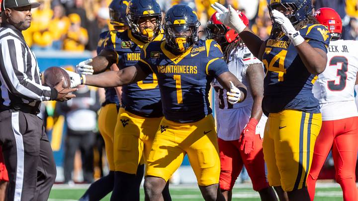 Oct 17, 2026; Morgantown, West Virginia, USA;  West Virginia Mountaineers running back Amari Latimer (1) celebrates after scoring a touchdown during the fourth quarter against the Cincinnati Bearcats at Milan Puskar Stadium.  Mandatory Credit: Ben Queen-Imagn Images