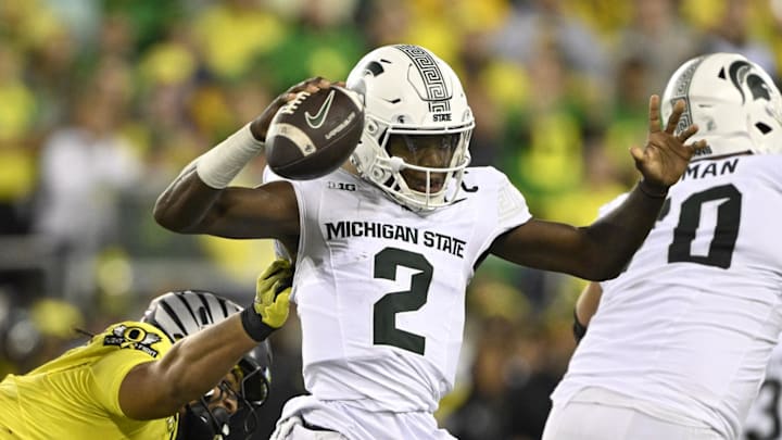 Oct 4, 2024; Eugene, Oregon, USA; Oregon Ducks defensive end Matayo Uiagalelei (10) sacks Michigan State Spartans quarterback Aidan Chiles (2) during the first half at Autzen Stadium. Mandatory Credit: Troy Wayrynen-Imagn Images 